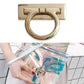 Gold-tone bull-nose ring lock on clear handbag strap with bag hardware
