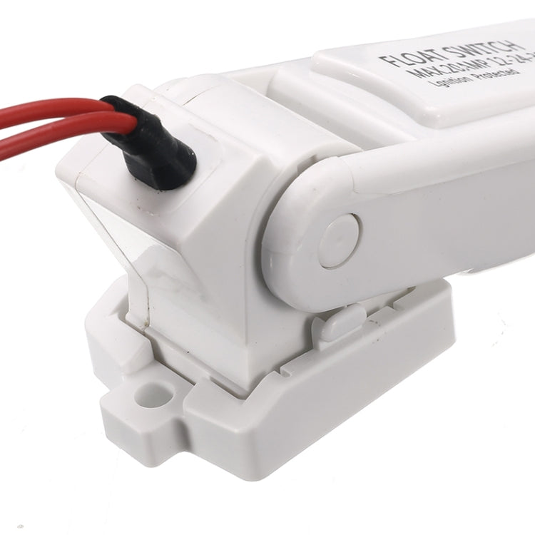 Close-up of white float switch controller body with black sensor cap and red wire