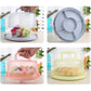 Assorted portable cake boxes in light blue, pink, and light green with domed lids.