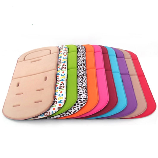 Stack of stroller seat cushion pads in pink, purple, orange, green, and blue tones.