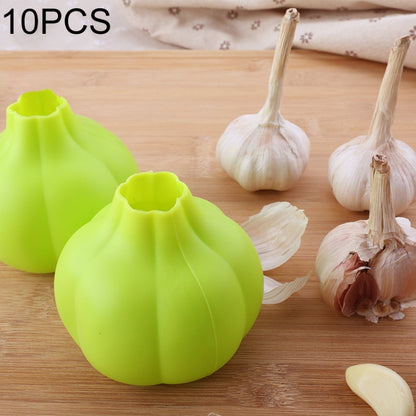 Lime green silicone garlic peeler bulb with small curved handle.