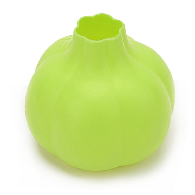 Lime green silicone garlic peeler with wide opening and molded ribs.