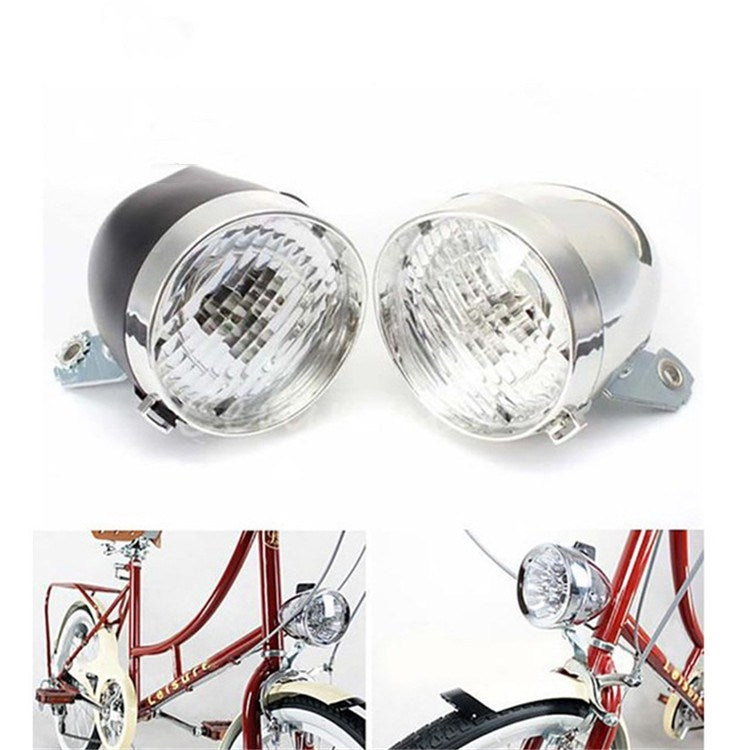 Pair of retro bicycle LED headlights with chrome bodies and clear lenses