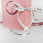 Pink "Handmade" satin ribbon roll with heart-shaped tag