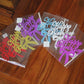 Mixed-color glitter Happy Birthday cake topper inserts in clear sleeves