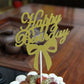 Gold glitter Happy Birthday cake topper insert with bow on a white pick