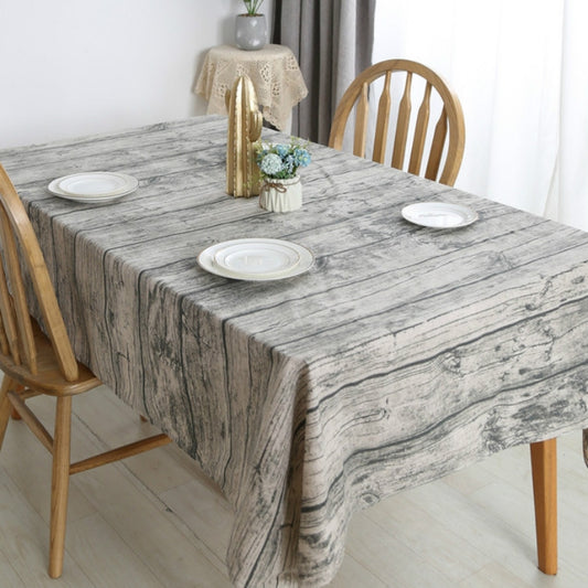 Rectangular linen tablecloth with gray-and-white woodgrain pattern, draped on table.