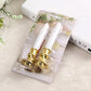 Two LED pillar candles in clear blister packaging with gold bases.