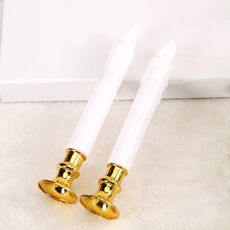 Pair of white LED pillar candles with clear wicks and gold holder bases.