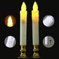 Two glowing yellow LED pillar candles with flame tops and gold bases.