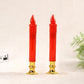 Two red LED pillar candles with clear wicks and gold bases.