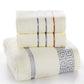 Cream cotton bath towel set with blue and orange stripe bands and Greek key corner trim