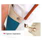 Blue denim apron strap detail with metal ring and adjustable brown leather buckle