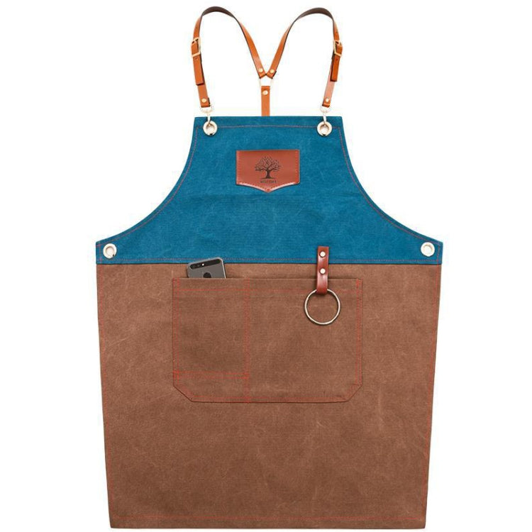 Two-tone denim apron with blue bib, brown body, front pocket, and adjustable leather straps