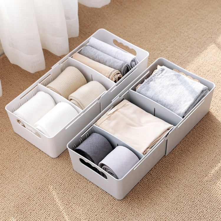 Two-piece open sock organizer with dividers; gray and white socks visible