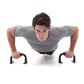 H-shaped push-up stand positioned on suction cup bases for hands during push-ups