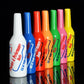 Assorted-color plastic squeeze bottles standing upright with printed labels.