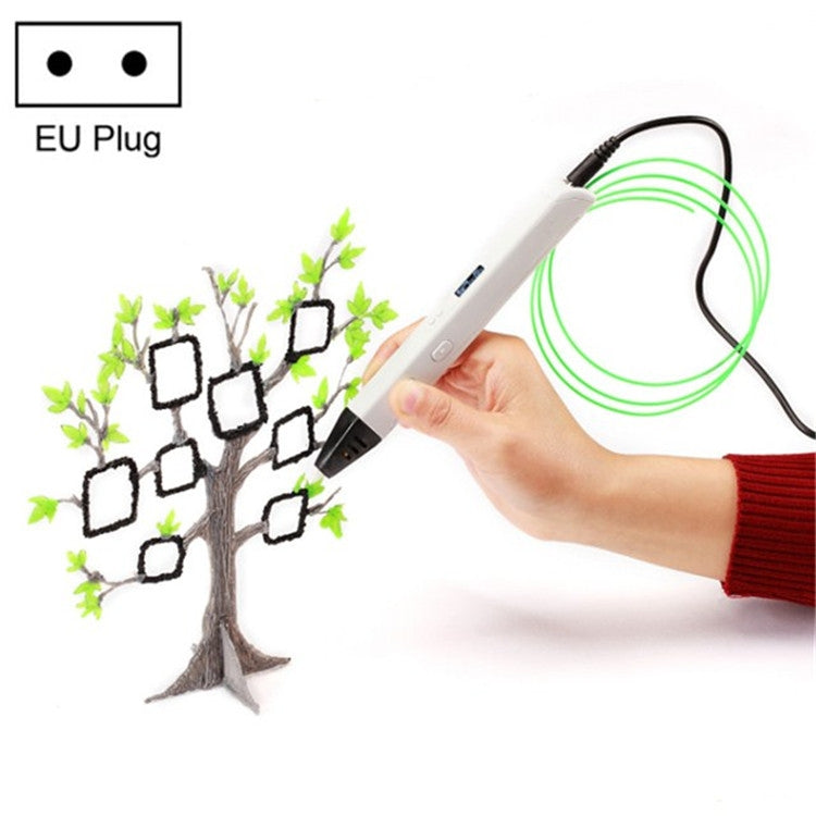White 3D printing pen in hand with green filament, EU plug; tree craft shown.