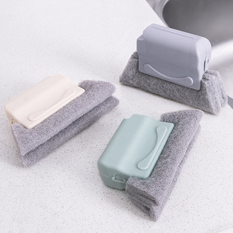 Assorted window groove cleaning brushes with gray scrub pads and light plastic scrapers