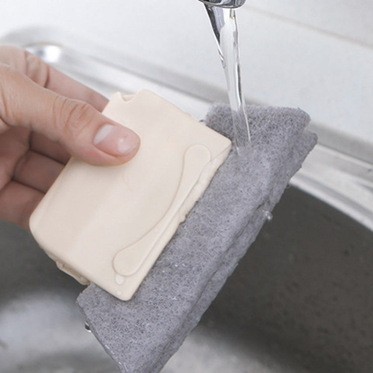 Window groove cleaning brush with gray scrub pad and beige plastic scraper being rinsed