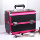 Pink and black makeup toolbox case with silver handle, corner locks, and makeup brushes