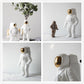 Set of astronaut ceramic vases in white, showing multiple angles and poses