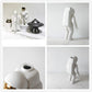 White astronaut ceramic vase figurine, multiple views including front and side