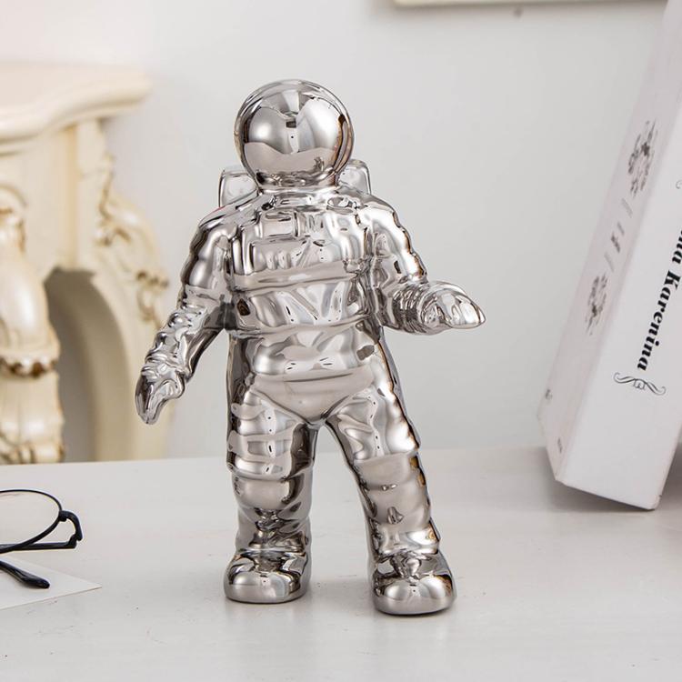 Silver astronaut ceramic vase figurine, full-body standing pose