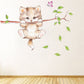 Cute cat wall sticker featuring a twig branch, green leaves, and purple butterfly