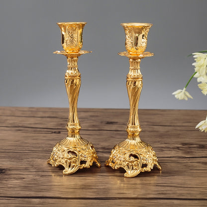 Gold two-piece candle holder set with ornate goblet tops and fluted bases