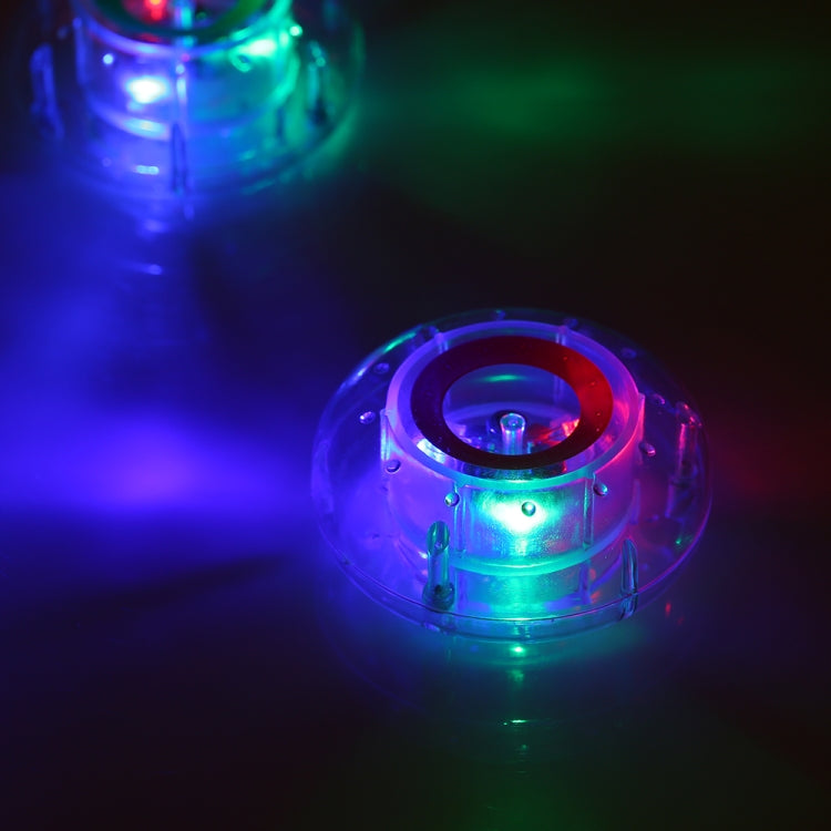 Glowing floating LED pool lamp with blue and green light inside clear dome