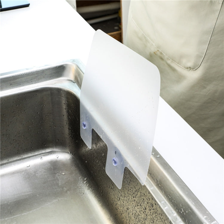 White splash-proof baffle board mounted in a sink with suction tabs attached.