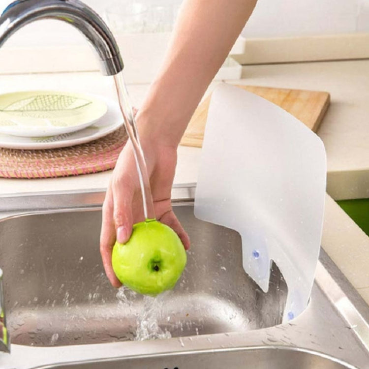 White splash-proof baffle board positioned in a sink to reduce splashing.