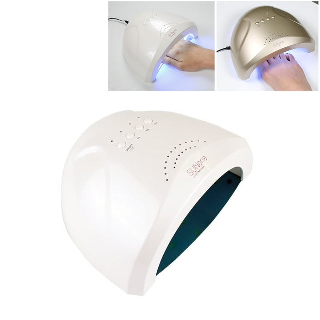 White UV nail polish dryer with curved hood, shown curing a hand with blue light