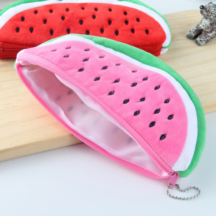 Pink watermelon plush pencil bag with zipper, holding pens and showing open interior