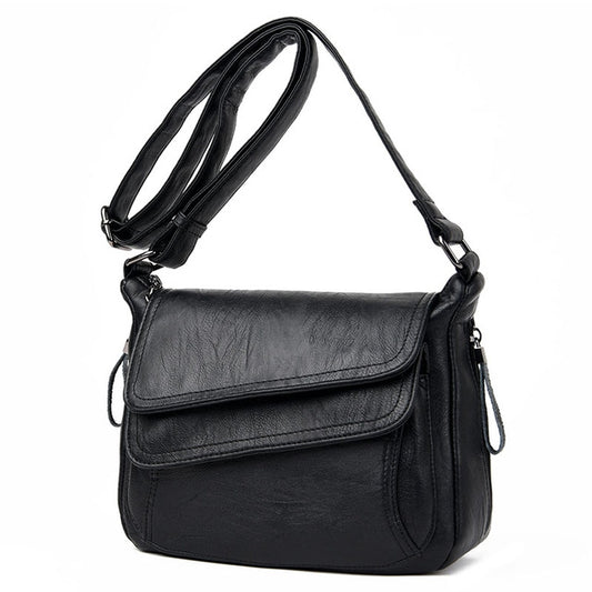 Black leather shoulder messenger bag with flap and adjustable crossbody strap