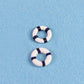Two mini lifebuoy rings, white with navy bands