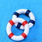 Mini lifebuoy rings, red-and-white stripes with navy band details