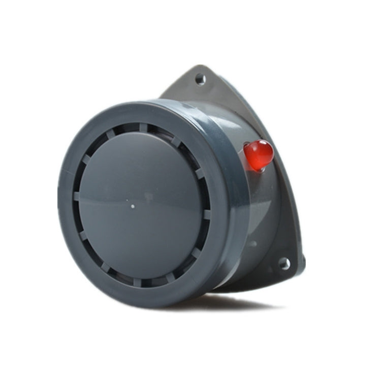 Water leak alarm detector angled view with circular grille and red button on gray body