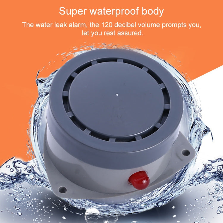 Water leak alarm detector with circular speaker grille and red button on gray housing
