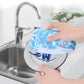 Microfiber flower printed cloth held under a kitchen sink faucet for washing