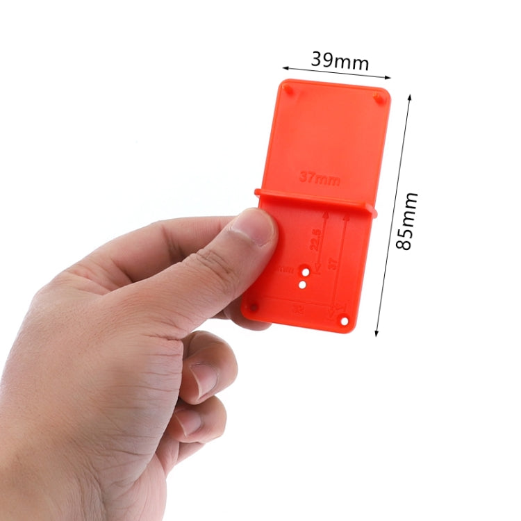Orange hinge opening positioner with mounting holes, shown with size guide 39mm x 85mm