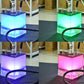 LED-lit acrylic hookah base with chrome stem and black hose, glowing blue and green