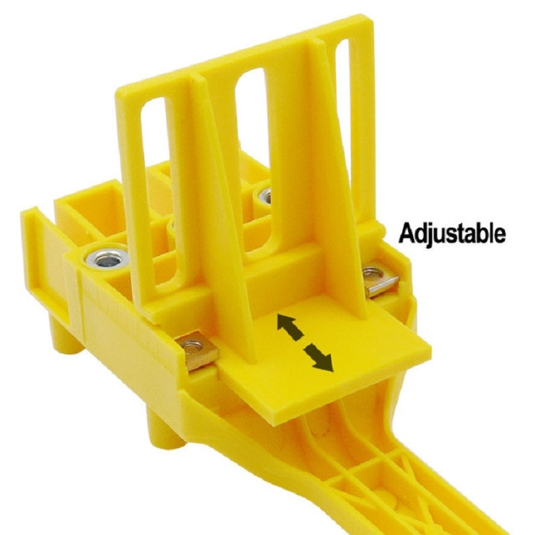 Yellow adjustable hole drilling positioner with guide fence and metal pin holes