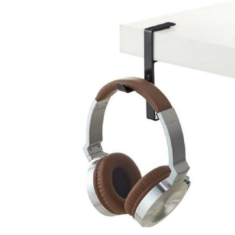 Desktop metal headphone stand holding brown and gray over-ear headphones on a desk