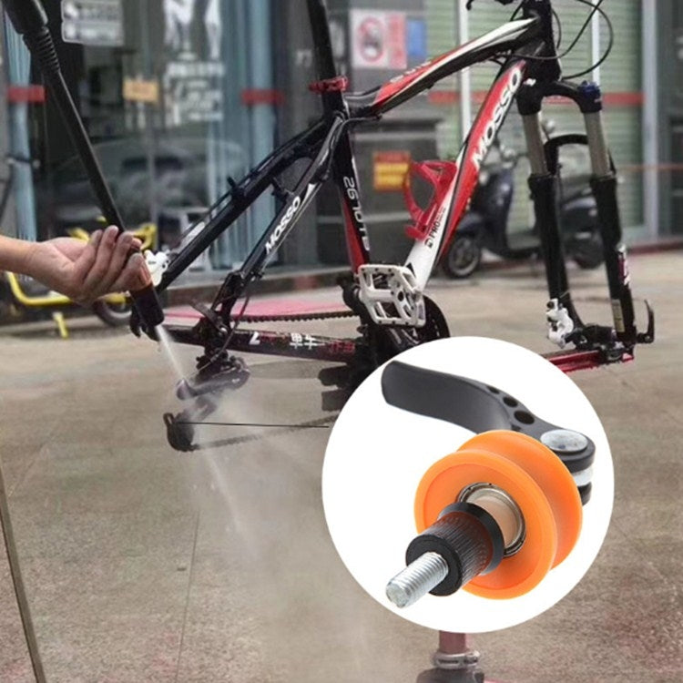 Chain support holder used on a bike: orange roller wheel with black lever