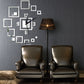Silver square acrylic wall clock set with black hands and mirror-style frame pieces