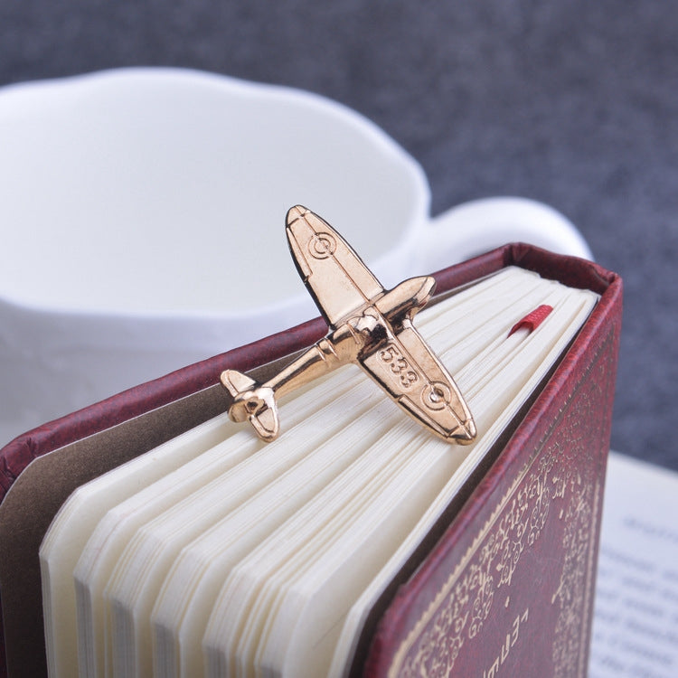 Gold retro airplane brooch pin, front view with hinge clasp