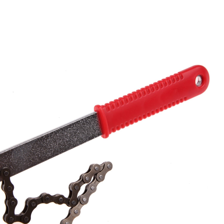 Red handle bicycle chain repair tool with flat metal blade