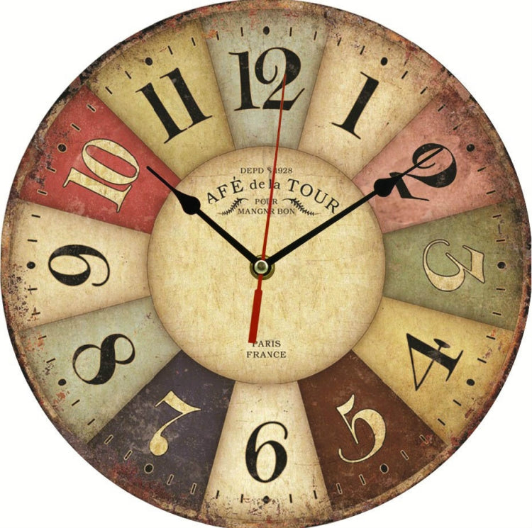 Vintage wall clock with round distressed dial, black hands, Roman numerals, muted tones.